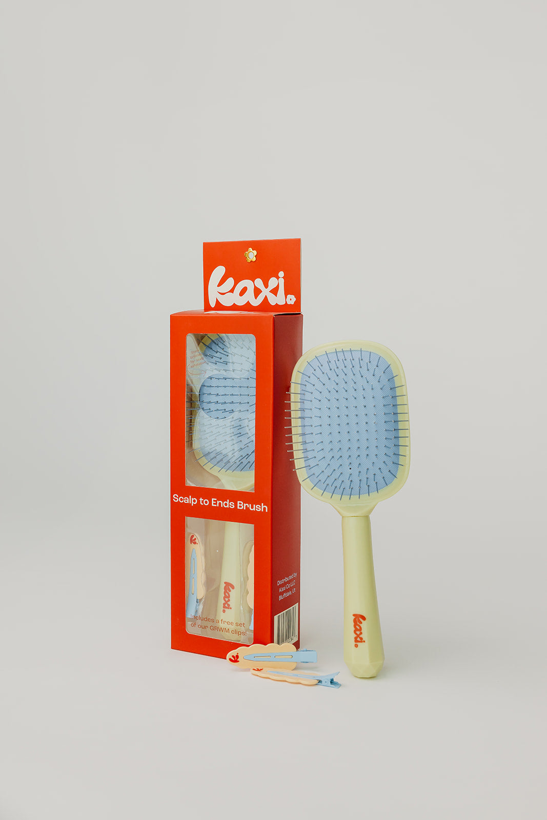 KAXI Scalp To Ends Brush in yellow with baby blue cushion and metal bristles