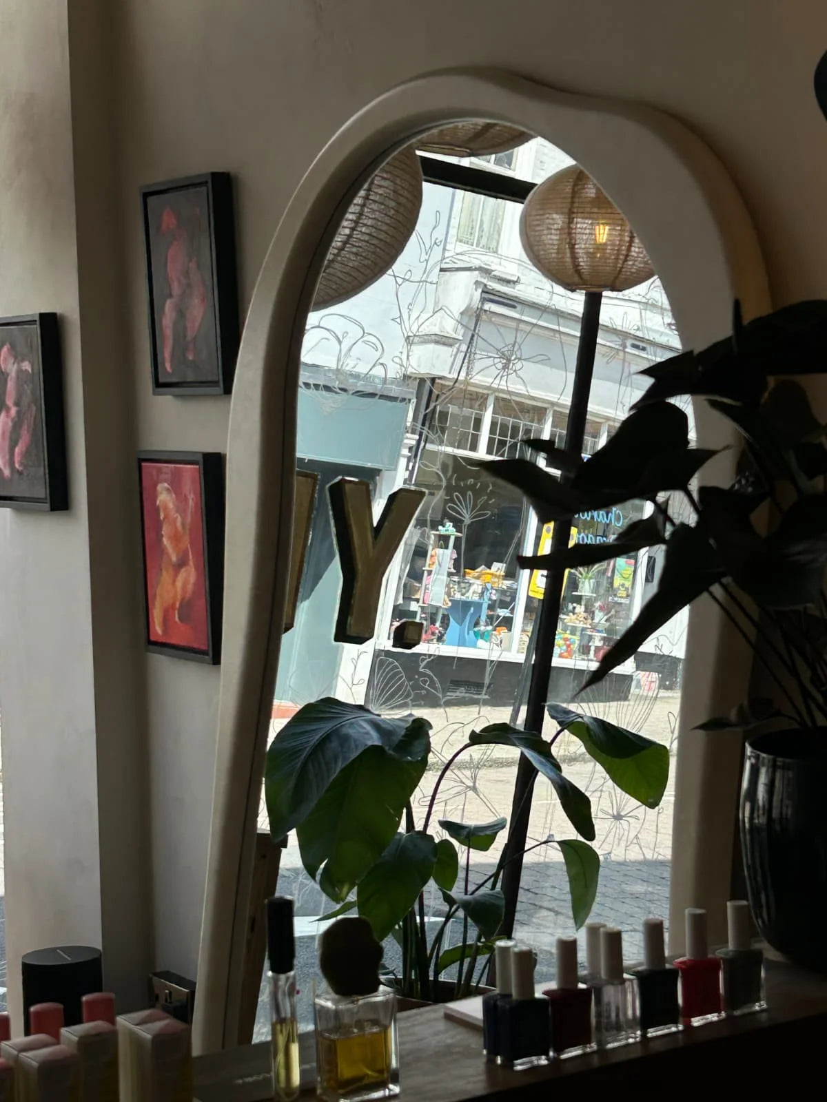 The sculptural mirror and seating area inside SHY
